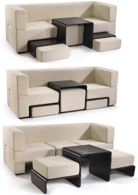 Modular beige sofa with integrated black tables and ottomans, transforming for versatile modern seating.