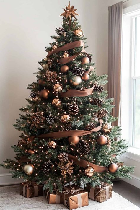 Elegant Christmas tree with brown ornaments and ribbons near window, surrounded by wrapped gifts.
