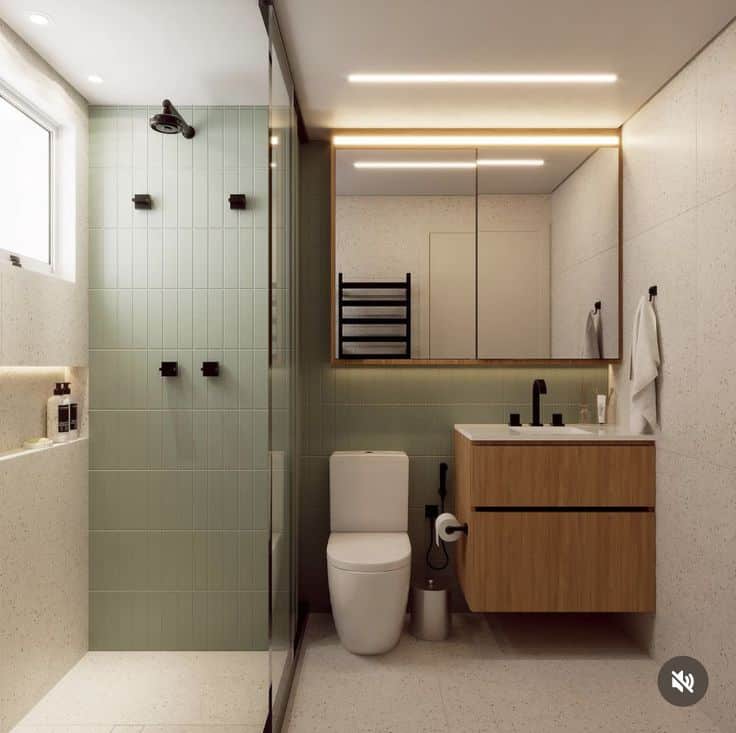 Modern bathroom with glass shower, wooden vanity, and large mirror in minimalist design.