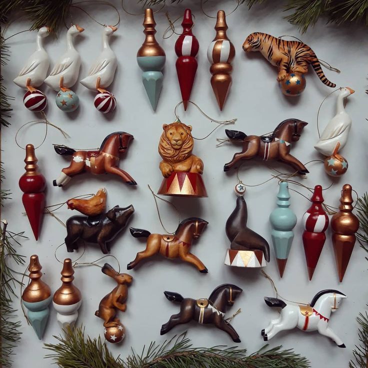 _ 2 Vintage circus-themed Christmas ornaments featuring animals and decorative baubles displayed on a white background. | Sky Rye Design Vintage circus-themed Christmas ornaments featuring animals and decorative baubles displayed on a white background.