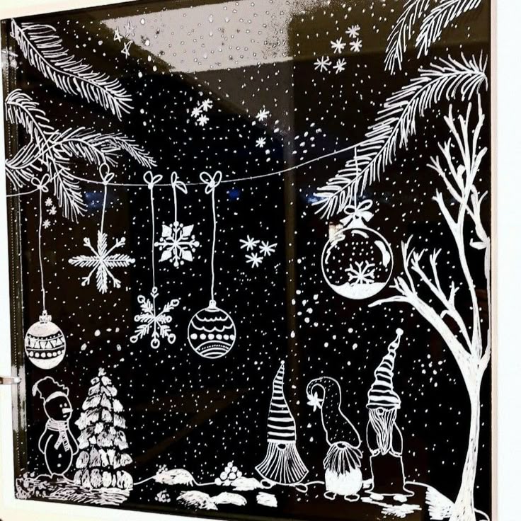 Festive window art with snowy landscape, hanging ornaments, and gnome figures, perfect for Christmas decoration inspiration.