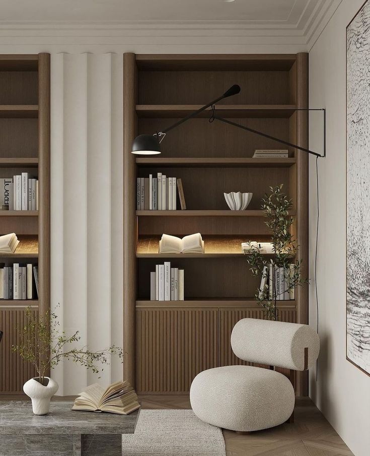 Modern living room with wooden bookshelf, stylish armchair, and decorative plants for a cozy reading nook.