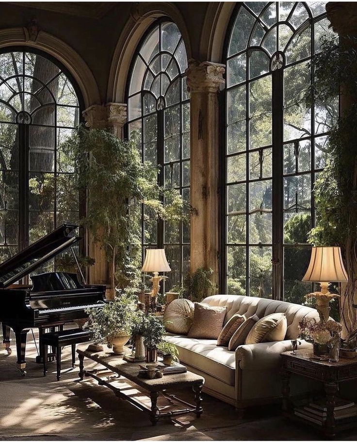 Luxurious living room with large arched windows, elegant sofa, grand piano, and lush greenery for a peaceful ambiance.