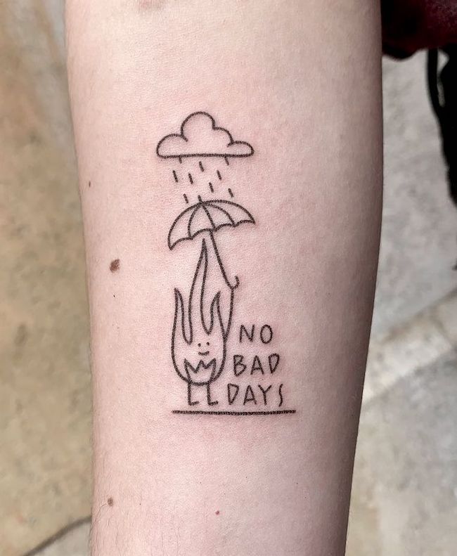 Minimalist tattoo of a smiling flame holding umbrella in rain with No Bad Days text. Positive mindset art.