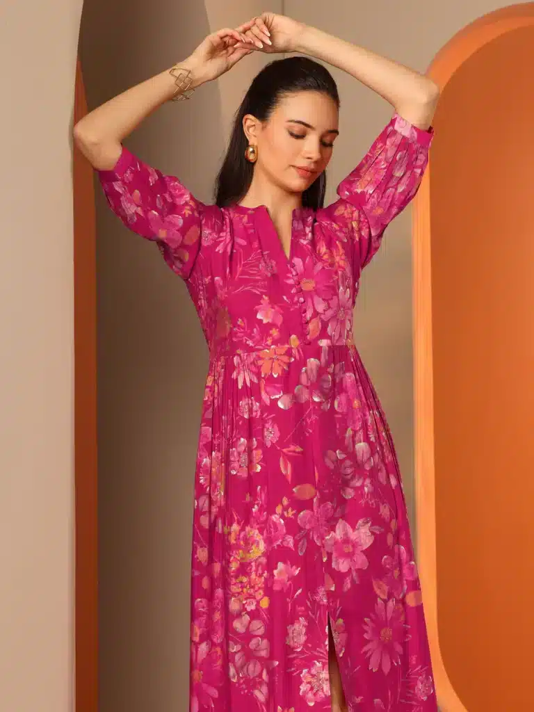 29786_5MAIN Woman in bright pink floral dress poses in elegant archway, showcasing stylish fashion and accessories. | Sky Rye Design Woman in bright pink floral dress poses in elegant archway, showcasing stylish fashion and accessories.