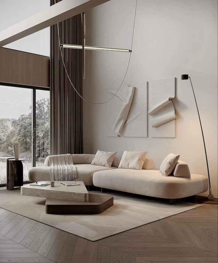 Minimalist living room with a beige sofa, abstract art, floor lamp, and large window for natural light. Modern décor.