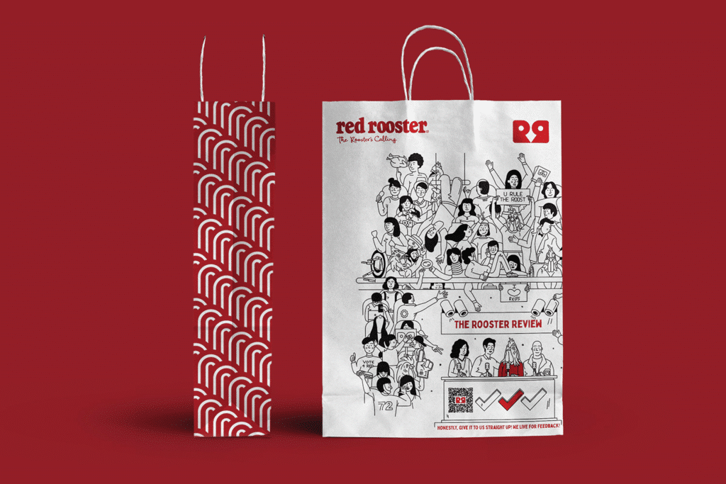 37bdfca2-6206-4bec-8b9e-f32cde4459a3 Red Rooster branded paper bags with playful illustration and bold red pattern on a red background. | Sky Rye Design Red Rooster branded paper bags with playful illustration and bold red pattern on a red background.