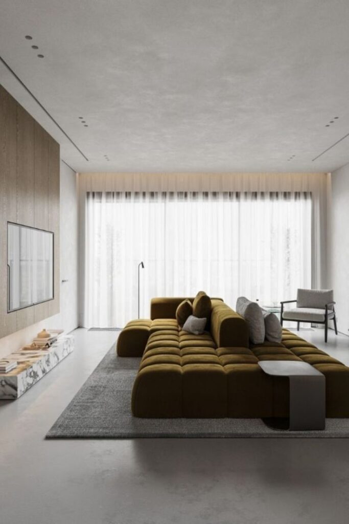 Modern living room with brown sectional sofa, large window, and minimalistic decor.