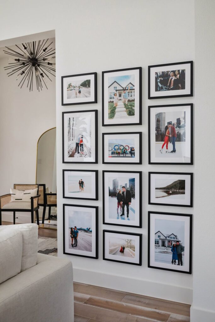 42b18c2656cd6a72bb39ebbae02aa07c Gallery wall with framed family photos in a modern living room, featuring a variety of memorable moments. | Sky Rye Design Gallery wall with framed family photos in a modern living room, featuring a variety of memorable moments.