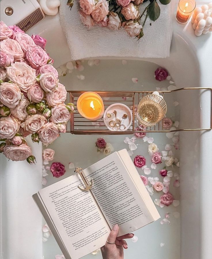 4f2547d4-ca57-4017-9881-6a8b556f9788 Luxurious bath setup with roses, lit candles, jewelry, wine glass, and a book for ultimate relaxation and self-care. | Sky Rye Design Luxurious bath setup with roses, lit candles, jewelry, wine glass, and a book for ultimate relaxation and self-care.
