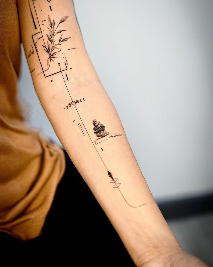 Modern minimalist arm tattoo featuring geometric shapes, botanical design, moon phases, and stacked stones.