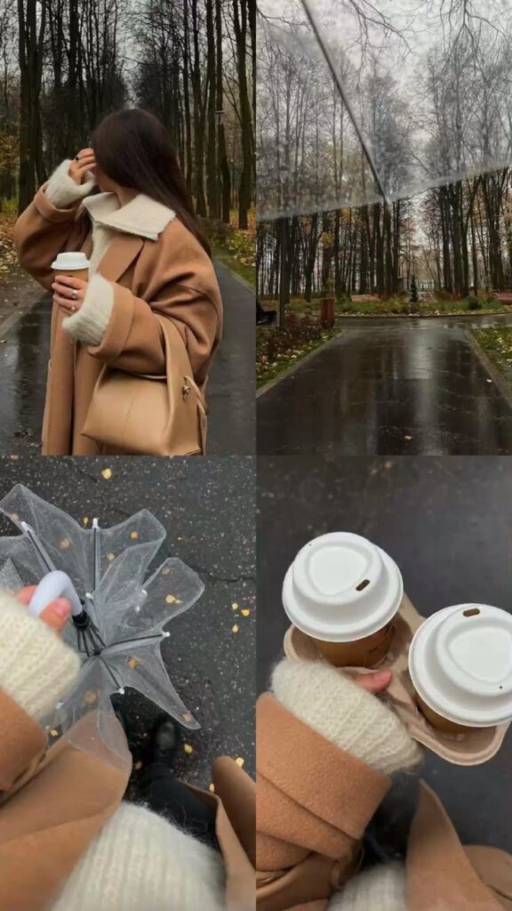 Woman in cozy coat enjoys a rainy walk with coffee and umbrella in autumn forest.