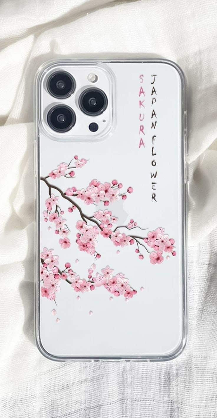 Clear phone case with pink sakura cherry blossoms and Japan Flower text, on white fabric background.
