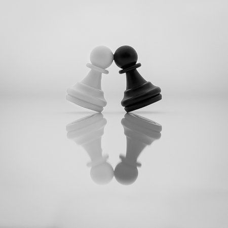 Black and white chess pawns mirrored on a reflective surface, symbolizing contrast and balance.