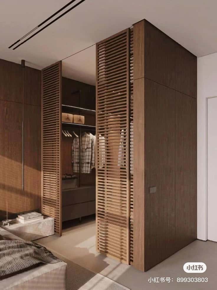 56787eeb-ada8-4735-951e-b18f018be7da Modern bedroom with wooden sliding closet doors, open wardrobe, and cozy neutral decor. | Sky Rye Design Modern bedroom with wooden sliding closet doors, open wardrobe, and cozy neutral decor.