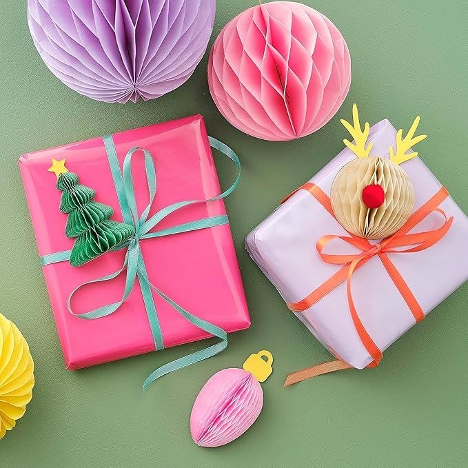 Colorful Christmas gifts with festive wrapping and decorations on green background. Perfect for seasonal celebrations.
