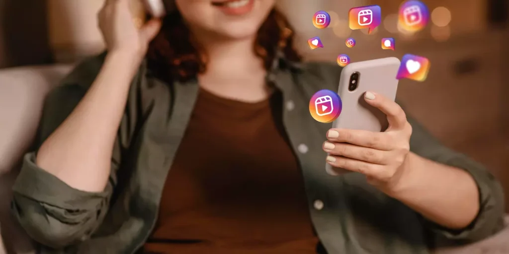 Woman using smartphone with social media engagement icons floating around, signifying viral content sharing.