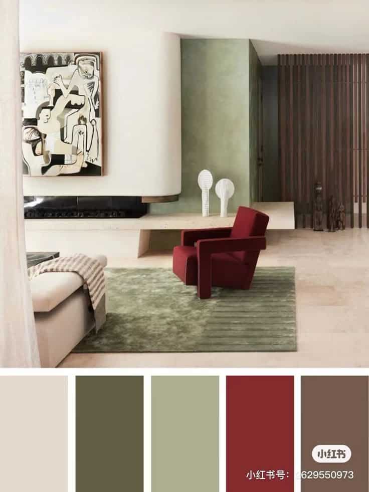 Modern living room with abstract art, red chair, green rug, and neutral tones. Cozy and stylish interior design.