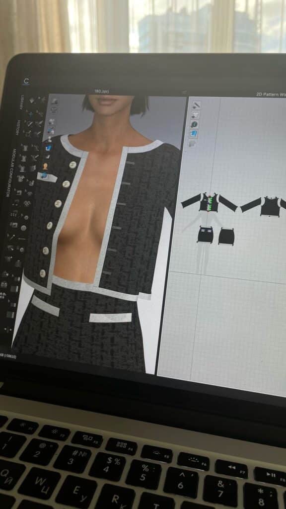_ 7 3D fashion design software displaying a digital outfit on a laptop screen, showcasing creative garment visualization. | Sky Rye Design 3D fashion design software displaying a digital outfit on a laptop screen, showcasing creative garment visualization.