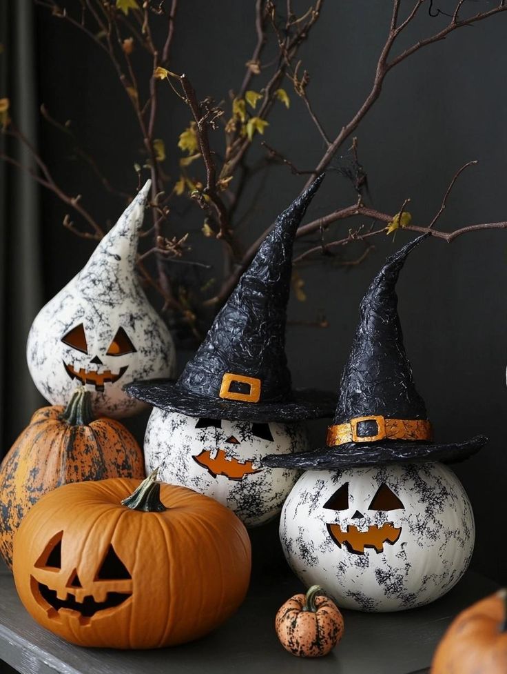 Halloween pumpkins with witch hats and spooky faces, surrounded by branches. Perfect for Halloween decoration.