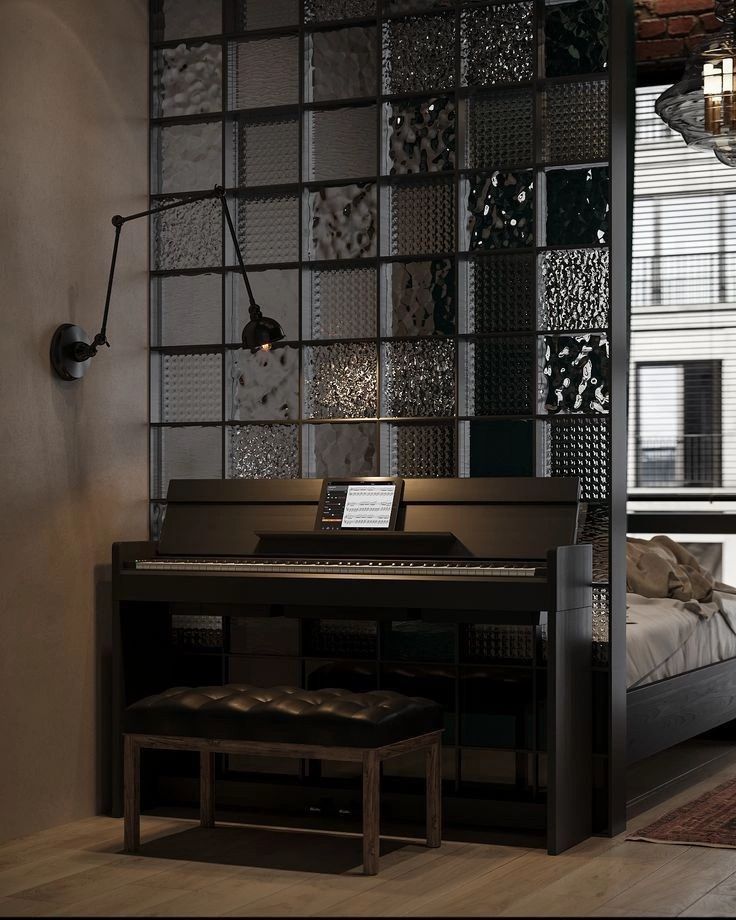Sleek digital piano with sheet music against a decorative glass wall, creating a modern and cozy room ambiance.