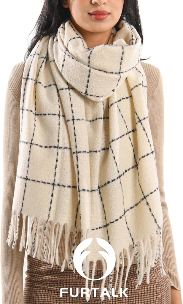 81BbWO8ywSL_AC_SX679_ Woman wearing a cream plaid scarf with fringe, layered over a beige sweater. | Sky Rye Design Woman wearing a cream plaid scarf with fringe, layered over a beige sweater.