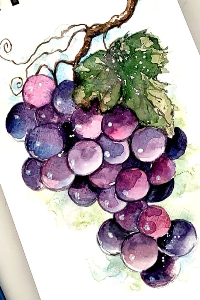 Watercolor painting of a vibrant bunch of purple grapes with green leaves.