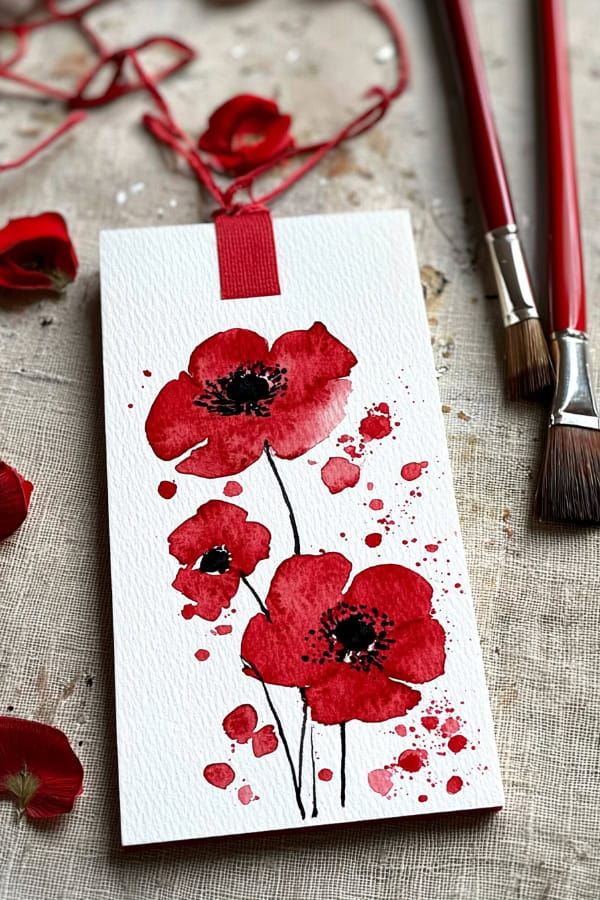 928fd2e0487f619ee2311dba9c642895 Watercolor poppy flowers on paper with paintbrushes, creating an artistic and floral design. | Sky Rye Design Watercolor poppy flowers on paper with paintbrushes, creating an artistic and floral design.