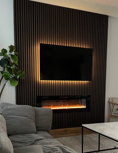 Acoustic Wood Slat Panels _ Decor Panels Accent Wall Ceiling 10 Panels _ eBay Modern living room with wall-mounted TV, wood paneling, electric fireplace, and cozy gray sofa. | Sky Rye Design Modern living room with wall-mounted TV, wood paneling, electric fireplace, and cozy gray sofa.