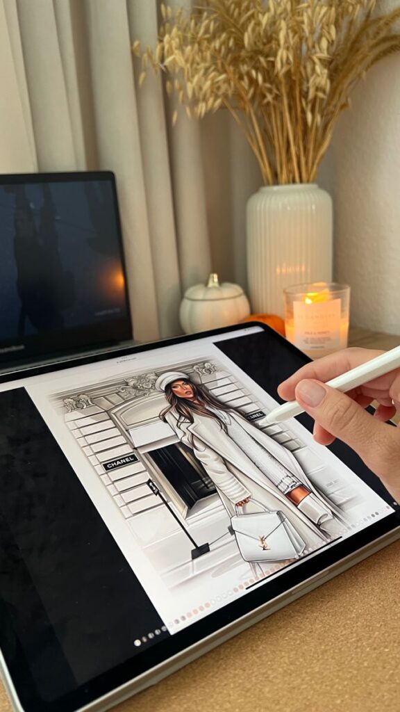 Aesthetics🍂 Digital sketching of fashion illustration on a tablet, with cozy desk setup in background. | Sky Rye Design Digital sketching of fashion illustration on a tablet, with cozy desk setup in background.