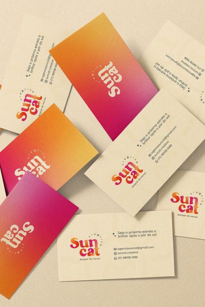 Colorful business cards for Suncat Creative brand design, featuring vibrant gradients and contact details.