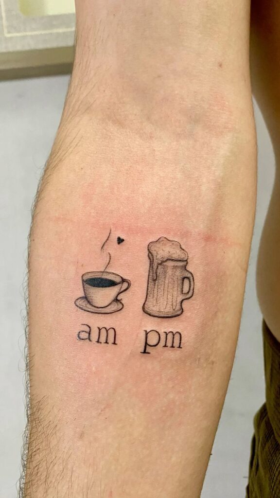 Tattoo on arm with coffee cup labeled am and beer mug labeled pm, symbolizing day and night preferences.