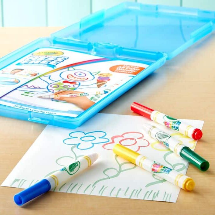 Crayola Color Wonder set with markers and flower drawing on a table. Mess-free art for kids.