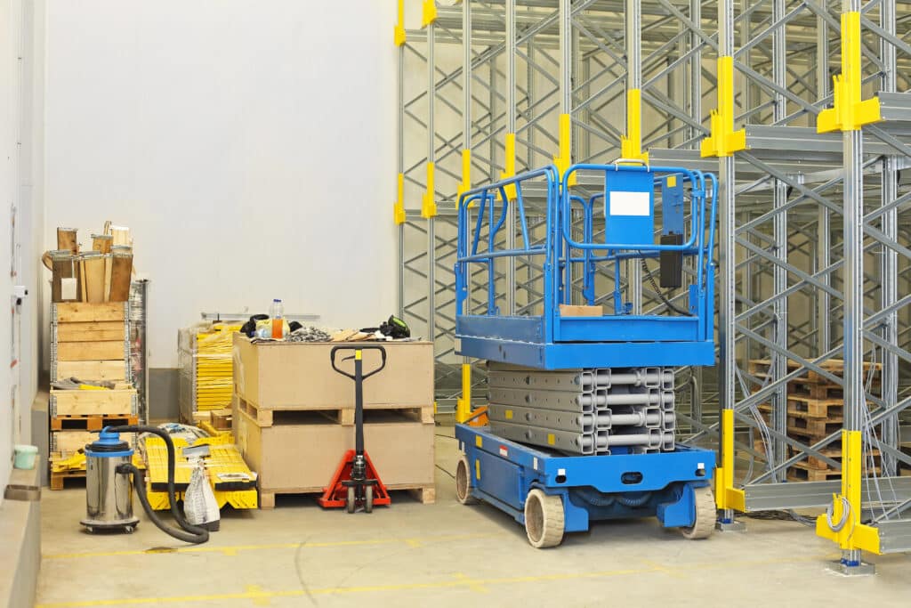 Depositphotos_54156397_XL Industrial warehouse with a lift, pallets, and organizing equipment for storage solutions. | Sky Rye Design Industrial warehouse with a lift, pallets, and organizing equipment for storage solutions.