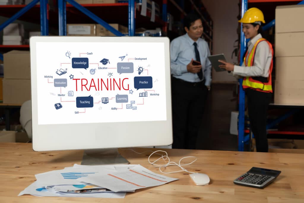 E-learning website with sofware for student to study on the internet snugly Warehouse training session with two professionals using a tablet, screen displaying training concepts. | Sky Rye Design Warehouse training session with two professionals using a tablet, screen displaying training concepts.