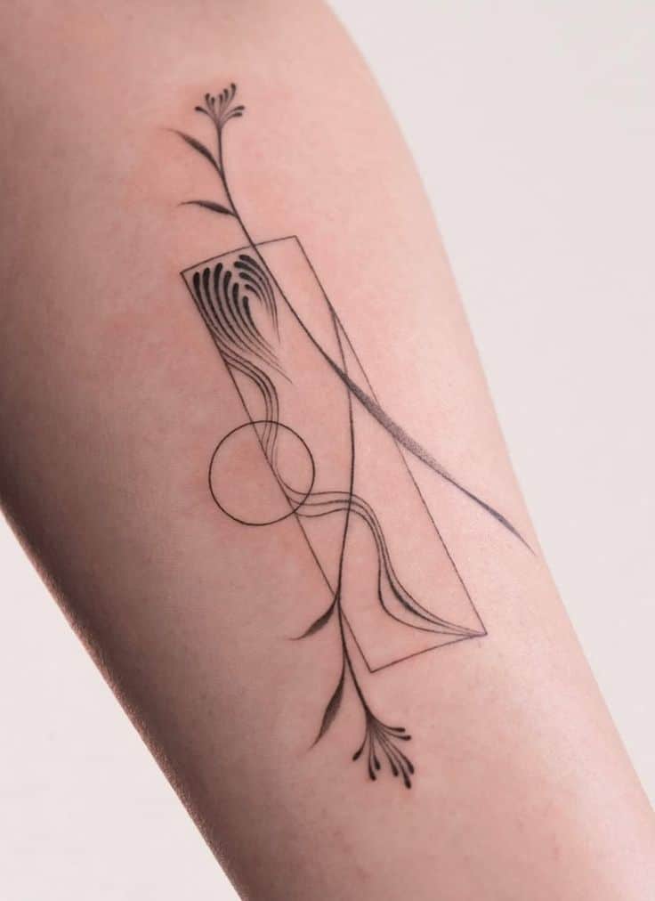 Minimalist line art tattoo with abstract shapes and floral elements on forearm.