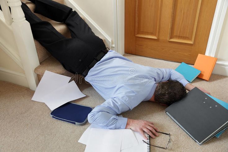 Man fallen on stairs with scattered papers and files, symbolizing workplace chaos and accidents.