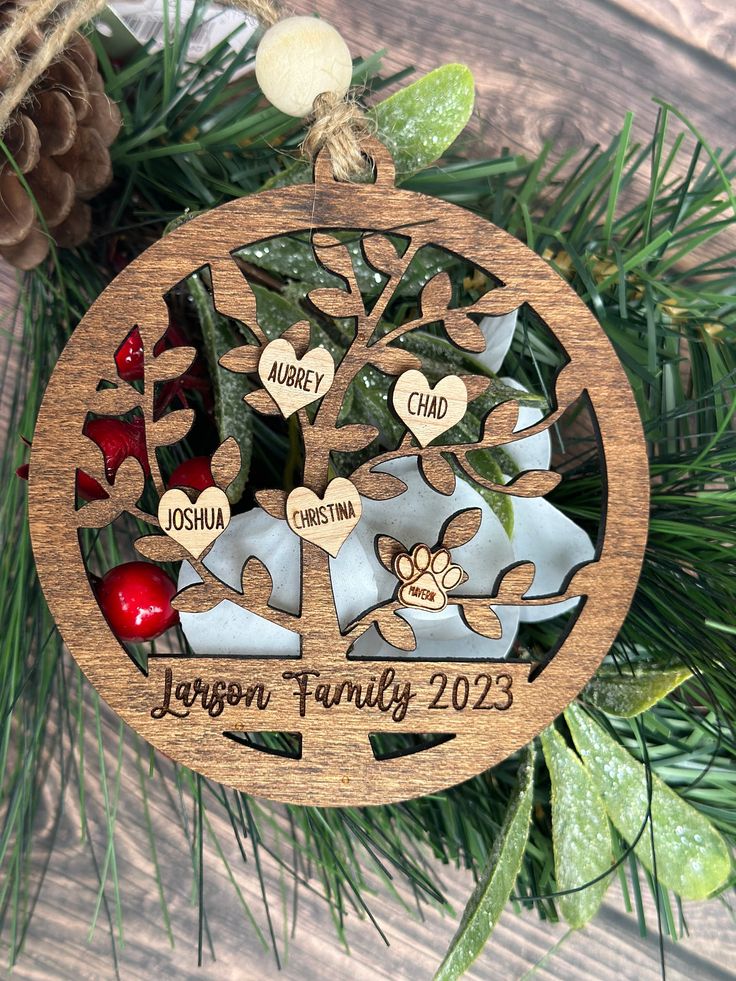 Family Tree Ornament Wooden family tree ornament with names and date, surrounded by greenery; personalized Christmas decoration. | Sky Rye Design Wooden family tree ornament with names and date, surrounded by greenery; personalized Christmas decoration.