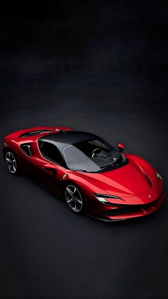 Red sports car with sleek design on dark background, showcasing modern aerodynamics and luxury performance.