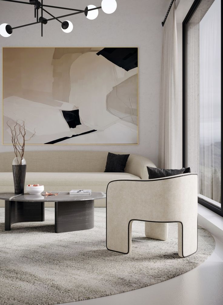 Modern living room with abstract art, beige sofa, round table, and contemporary lighting.