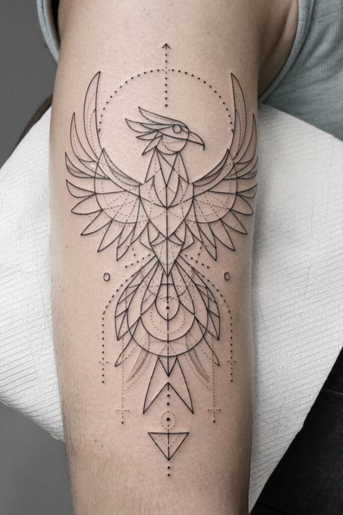 Geometric phoenix tattoo design on forearm, featuring intricate line work and symmetrical patterns.