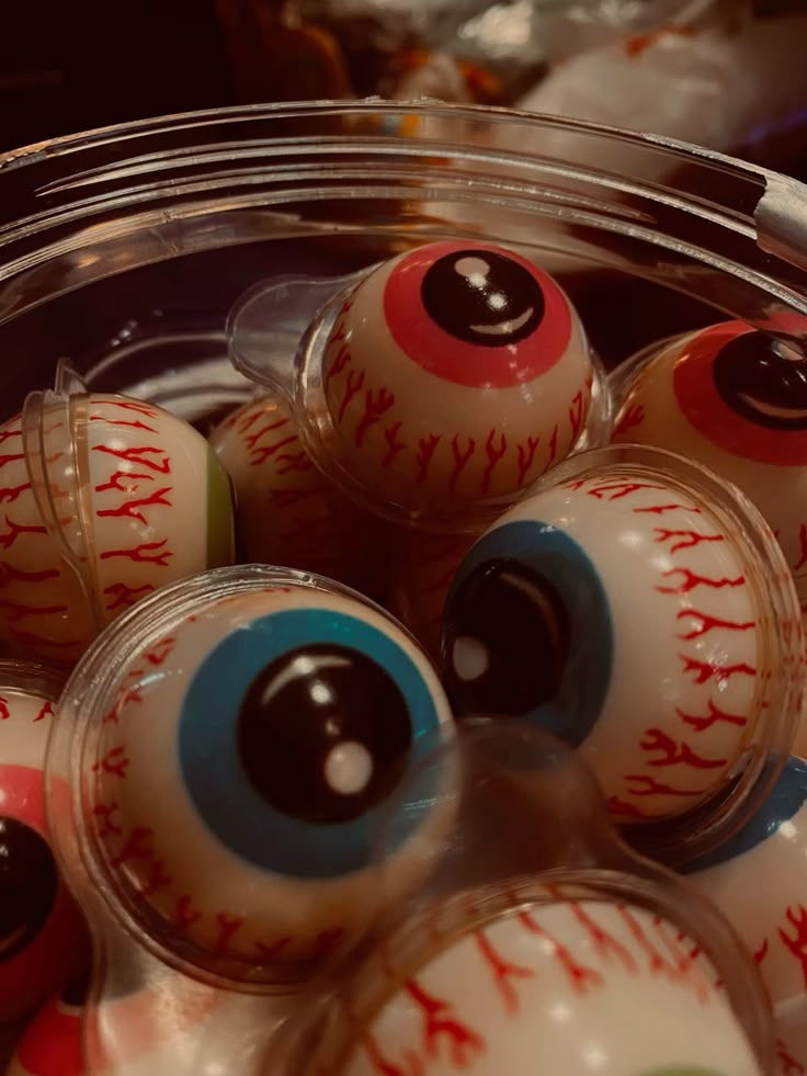 Halloween candy 🍬👻 Plastic eyeballs with colorful irises in a container, perfect for Halloween decorations or spooky crafts. | Sky Rye Design Plastic eyeballs with colorful irises in a container, perfect for Halloween decorations or spooky crafts.