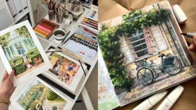 Handcrafted watercolor paintings on tables with art supplies, depicting scenic landscapes and a bicycle by a rustic building.