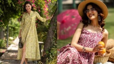 Two women enjoying a sunny day, one in a yellow dress, the other in a pink patterned dress holding oranges and wearing a sunhat.