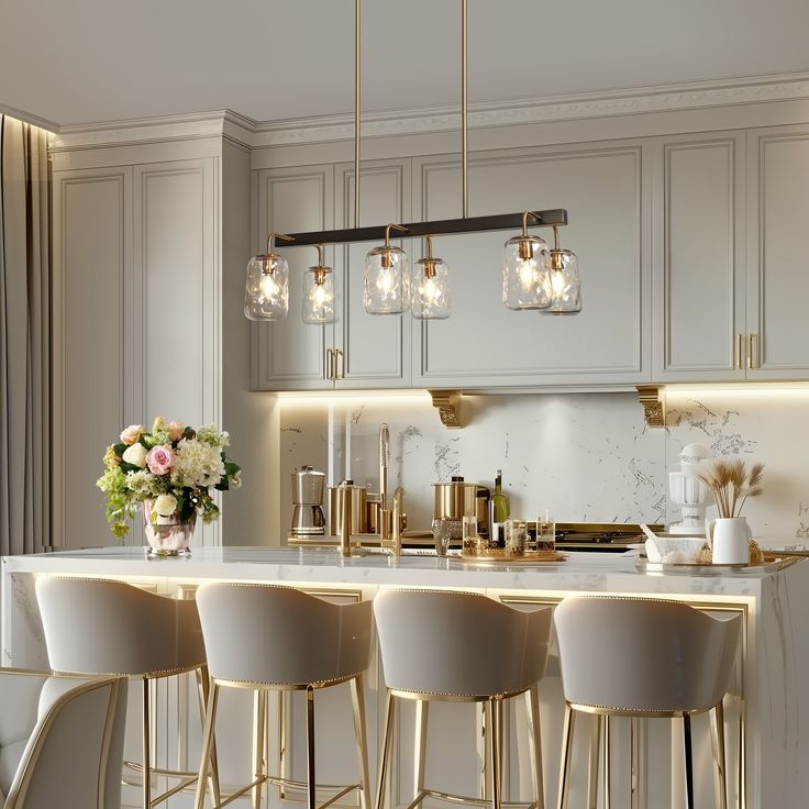 Luxurious kitchen with marble island, elegant pendant lights, and plush bar stools.