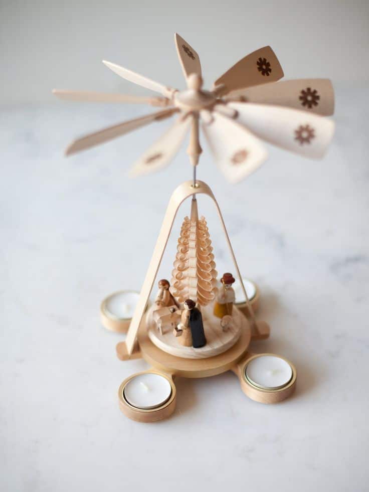 Large Wood Chip Tree Nativity Pyramid Wooden Christmas pyramid with figurines and tealight holders on a marble surface. | Sky Rye Design Wooden Christmas pyramid with figurines and tealight holders on a marble surface.