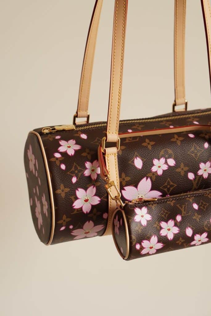 Louis Vuitton x Takashi Murakami Papillon Cherry Blossom from 2025 - THE MENUE Brown designer handbag with pink flower pattern and tan leather straps, elegant fashion accessory. | Sky Rye Design Brown designer handbag with pink flower pattern and tan leather straps, elegant fashion accessory.