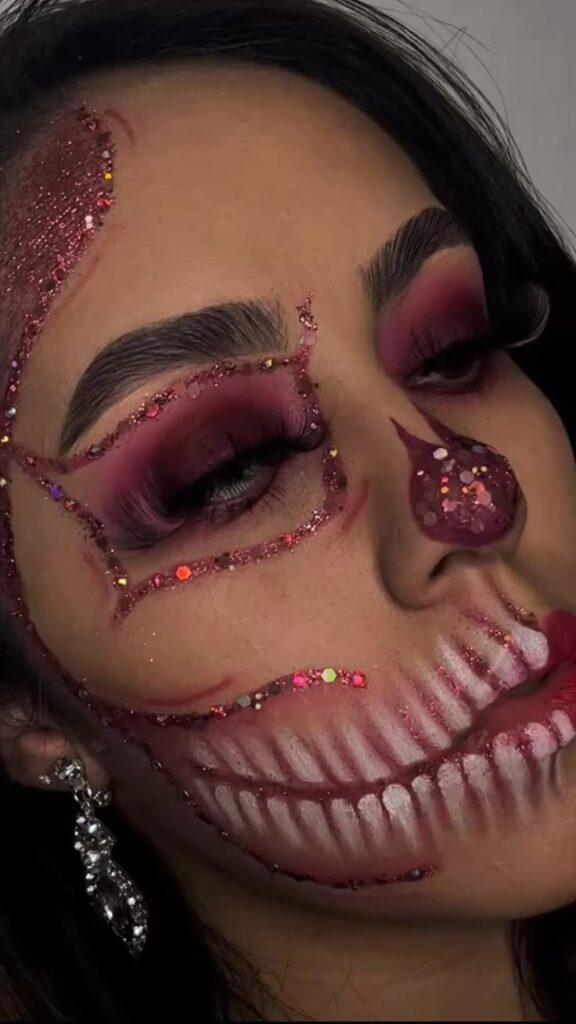 Lurella Glaze Glitter palette for her PINK SKULL look 💀 Woman with intricate skull makeup, glitter accents, and dramatic eye shadow for a Halloween-themed look. | Sky Rye Design Woman with intricate skull makeup, glitter accents, and dramatic eye shadow for a Halloween-themed look.