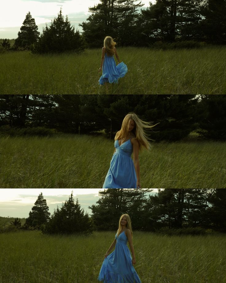 Woman in a flowing blue dress walking through a grassy field with trees in the background.