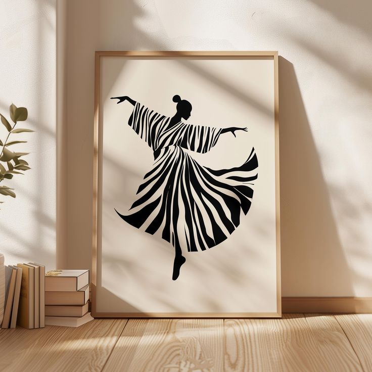 Framed silhouette art of a dancing figure in a zebra-striped dress, leaning against a sunlit wall with stacked books.